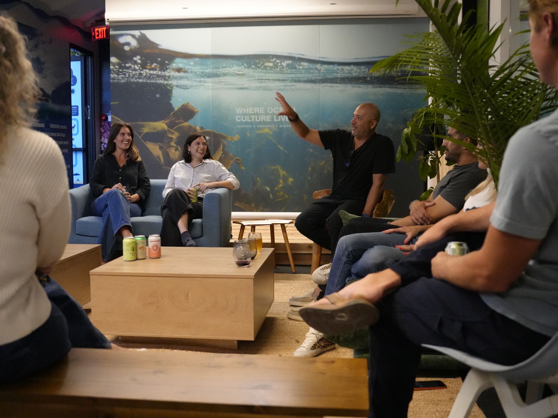 Panelists and guests laughing during the roundtable