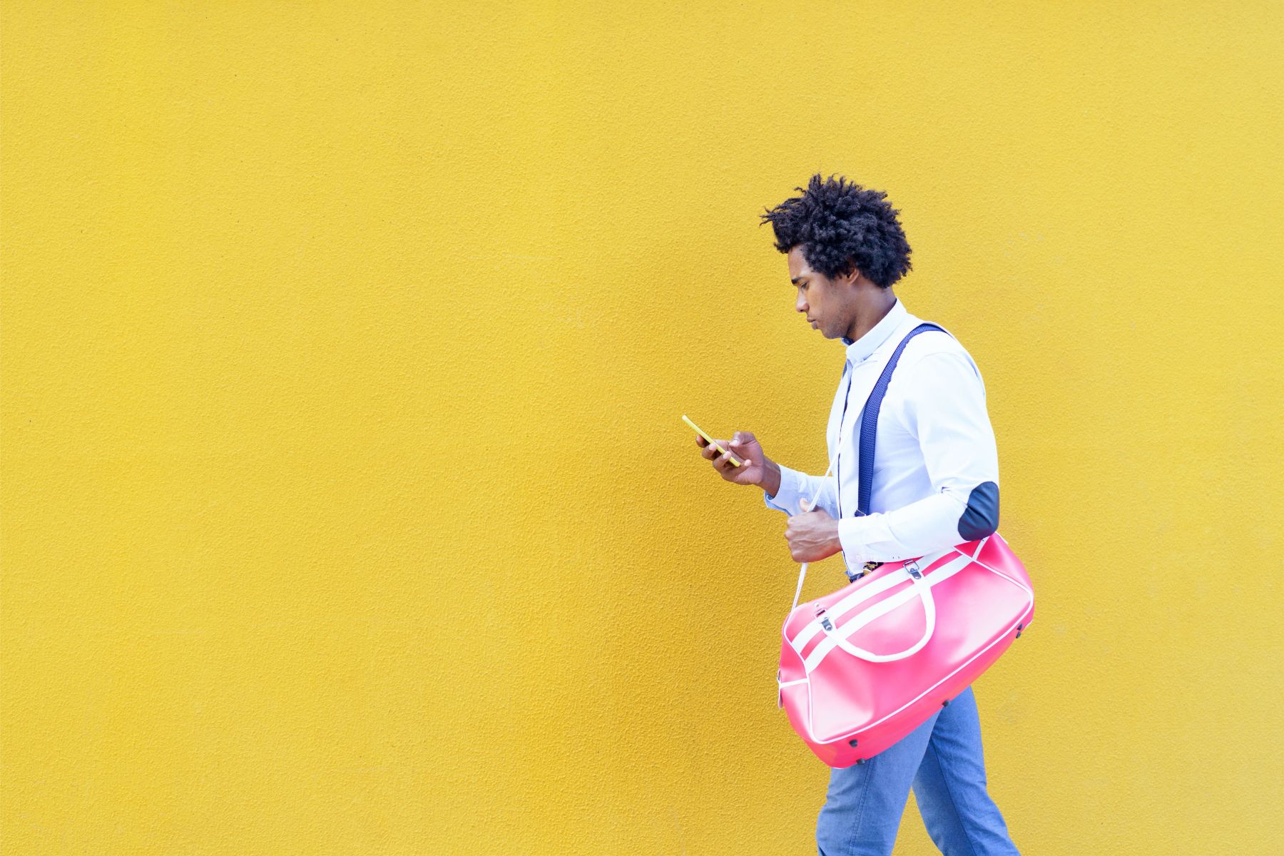 Shopper walking while browsing on a phone one-handed